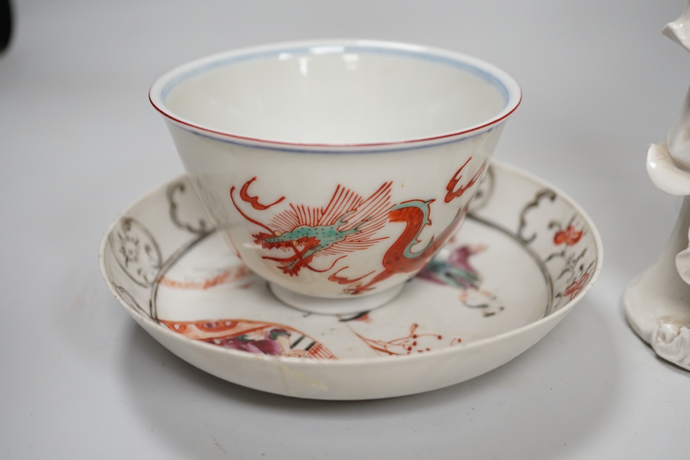 A Chinese figure of blanc de chine, a dragon tea bowl, a saucer, a large tankard, and another Chinese dish, tallest 23cm